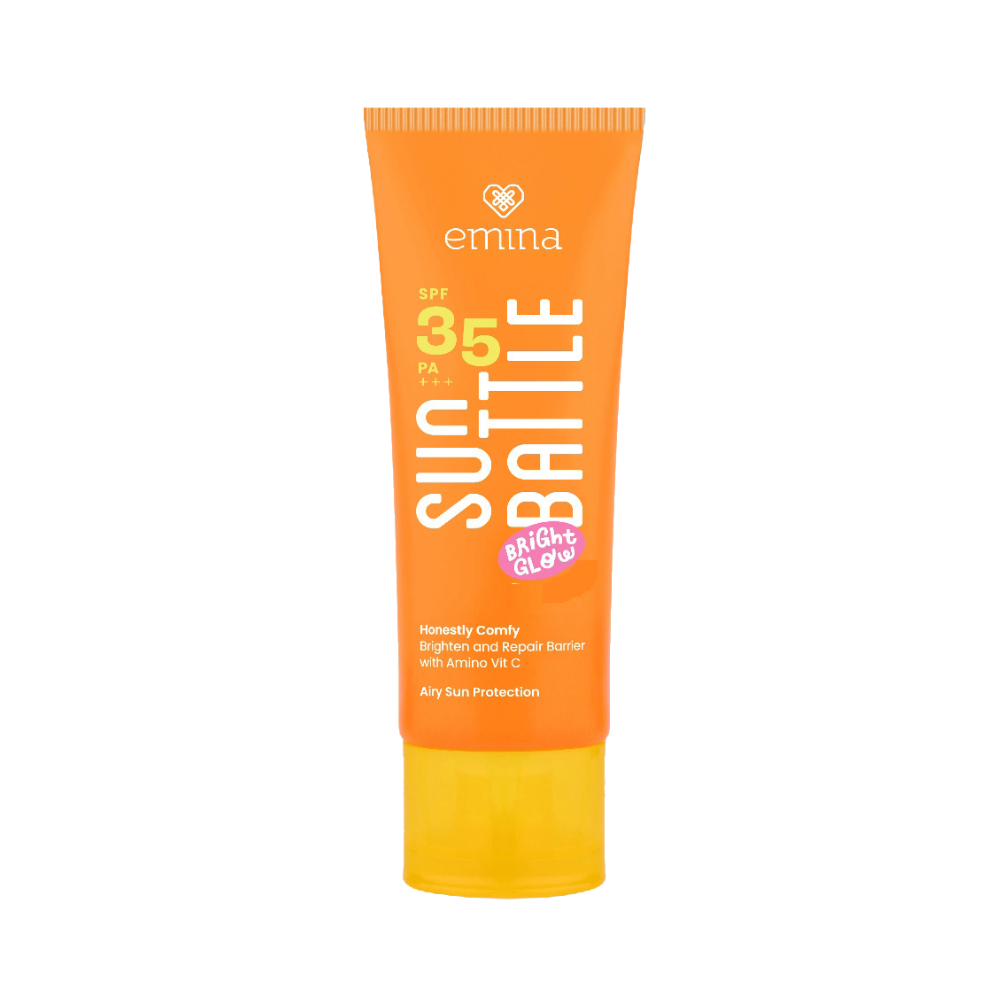 Foto produk sunscreen Emina Sun Battle SPF 35, dengan kemasan oranye dan label yang menonjolkan klaim Bright Glow dan perlindungan sinar matahari